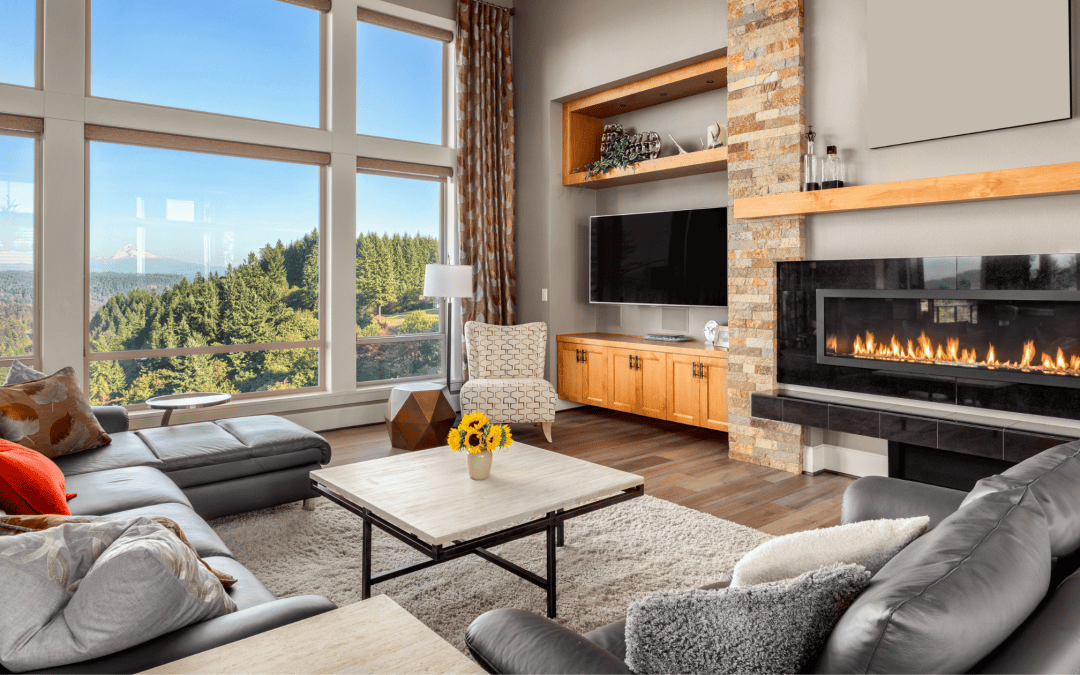 Bright living room with large windows and cozy fireplace. Stylish furniture and scenic views create.