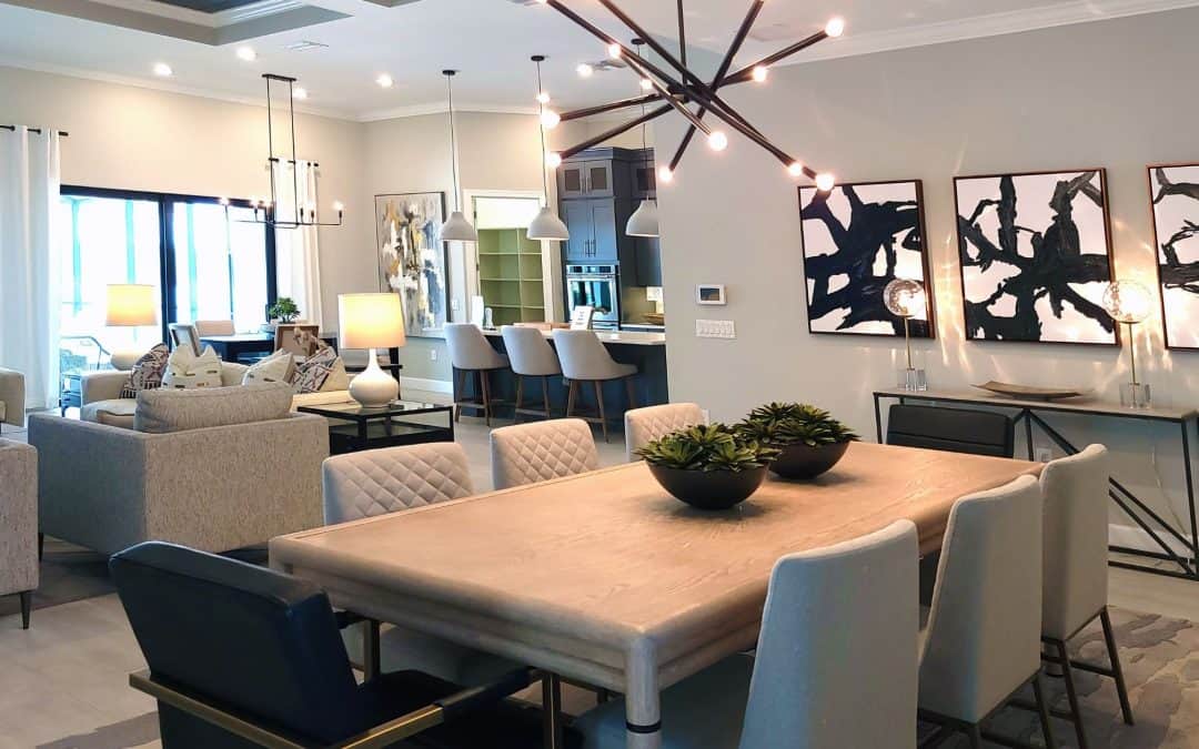 Spacious modern living room featuring an open-concept kitchen, contemporary furniture, and artistic.