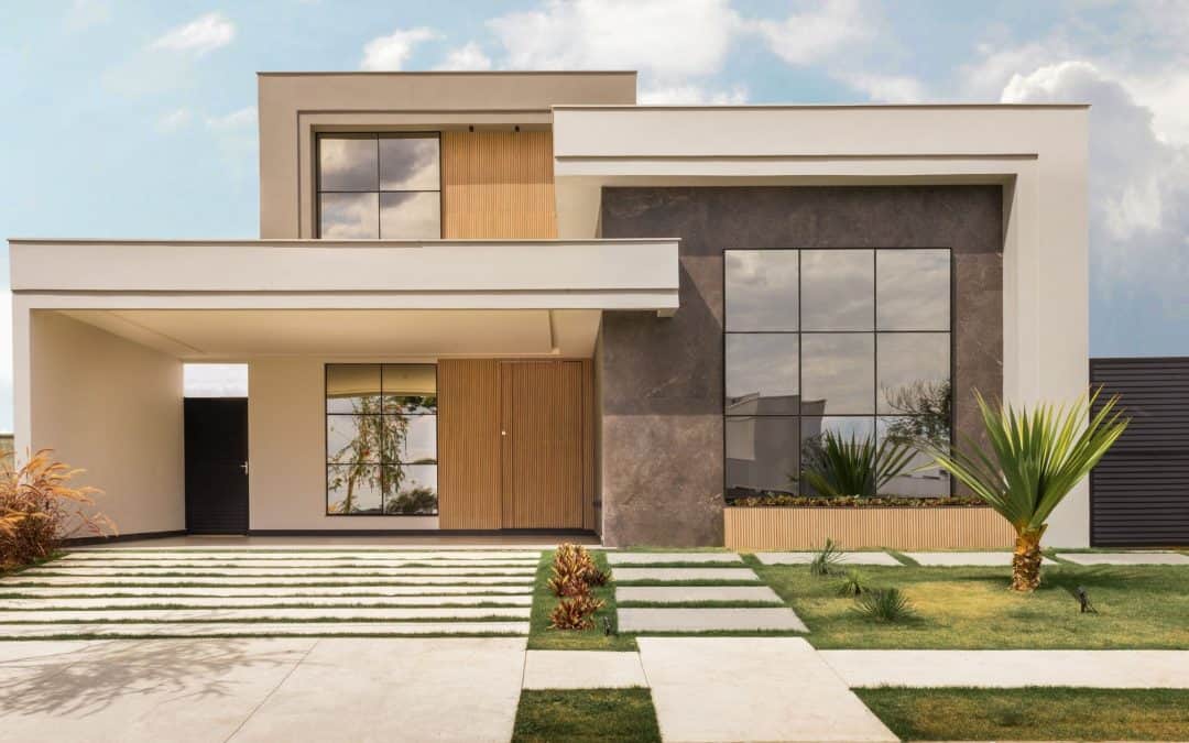 Contemporary modern house with sleek design, large windows, and landscaped yard.