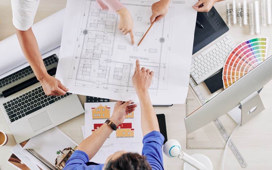 Team reviewing architectural blueprints for a construction project.