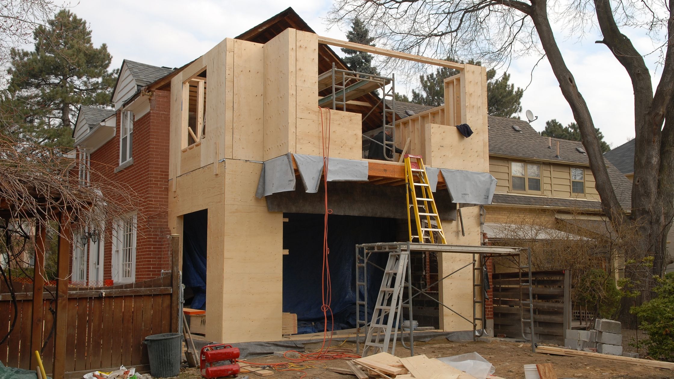 New residential home under construction by Choate Builders in a suburban neighborhood.