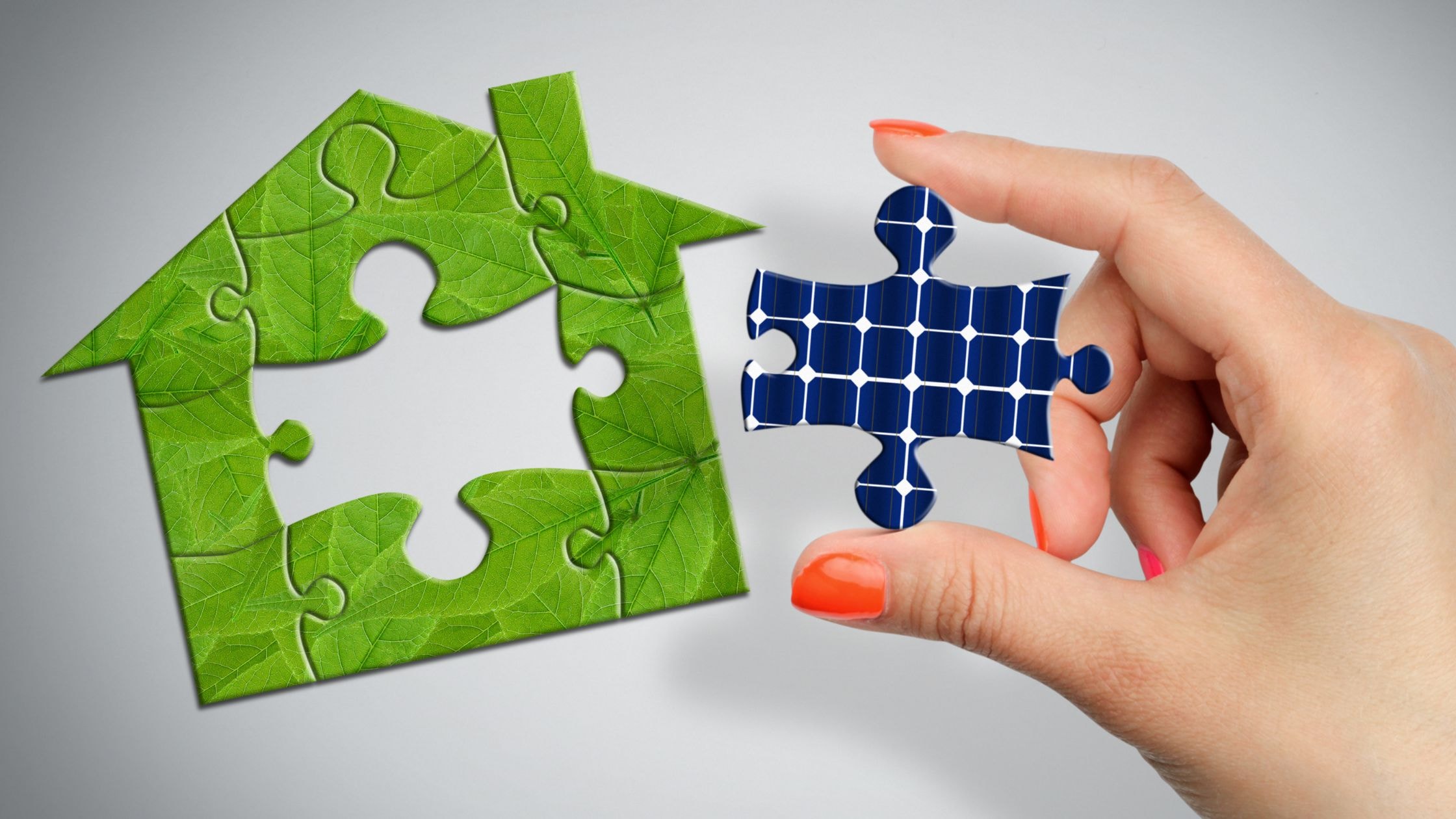 Custom home renovation puzzle piece held by hand, representing building and remodeling services.