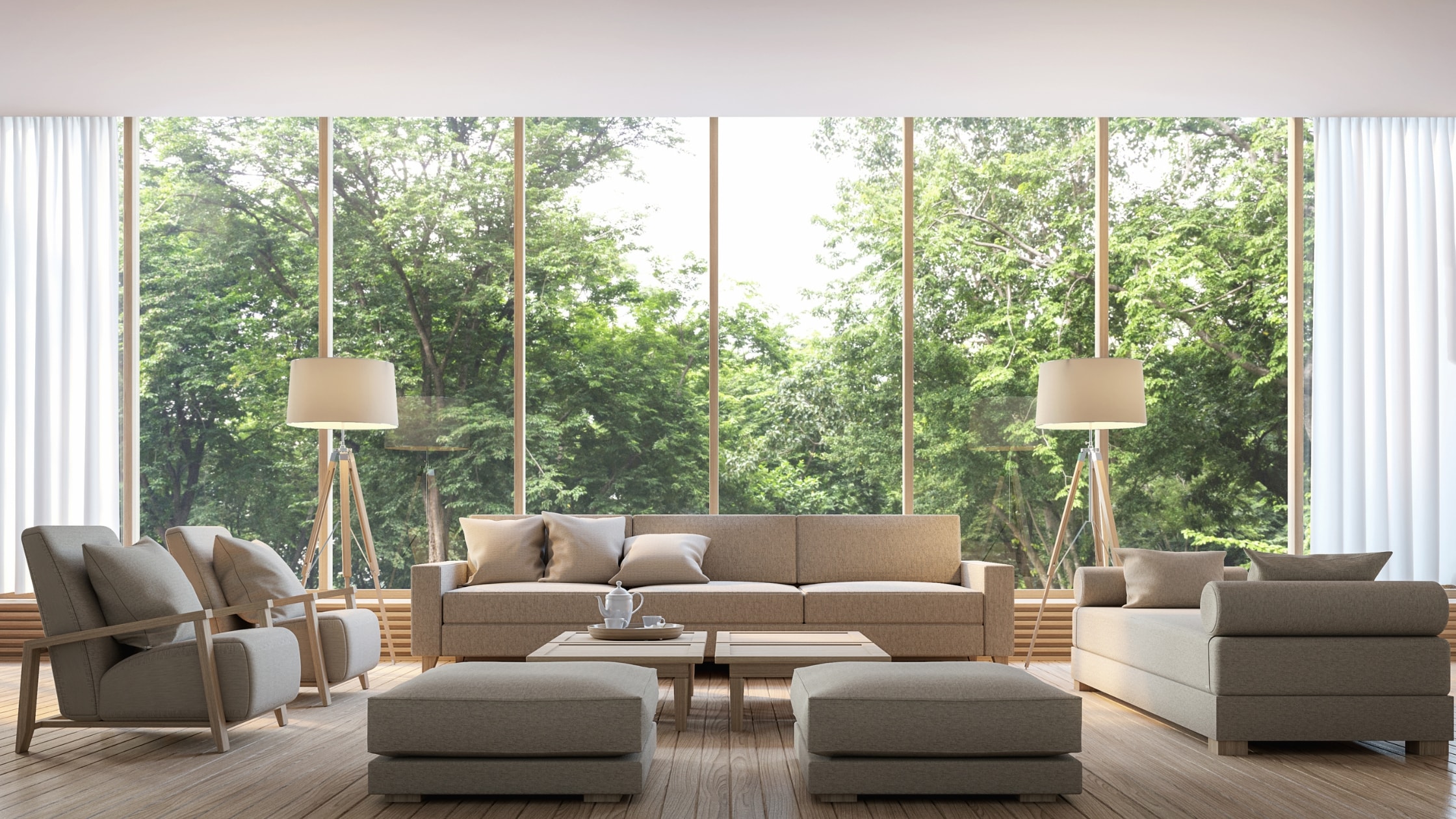 Spacious modern living room with large windows, comfortable sofas, and stylish decor, perfect for re.