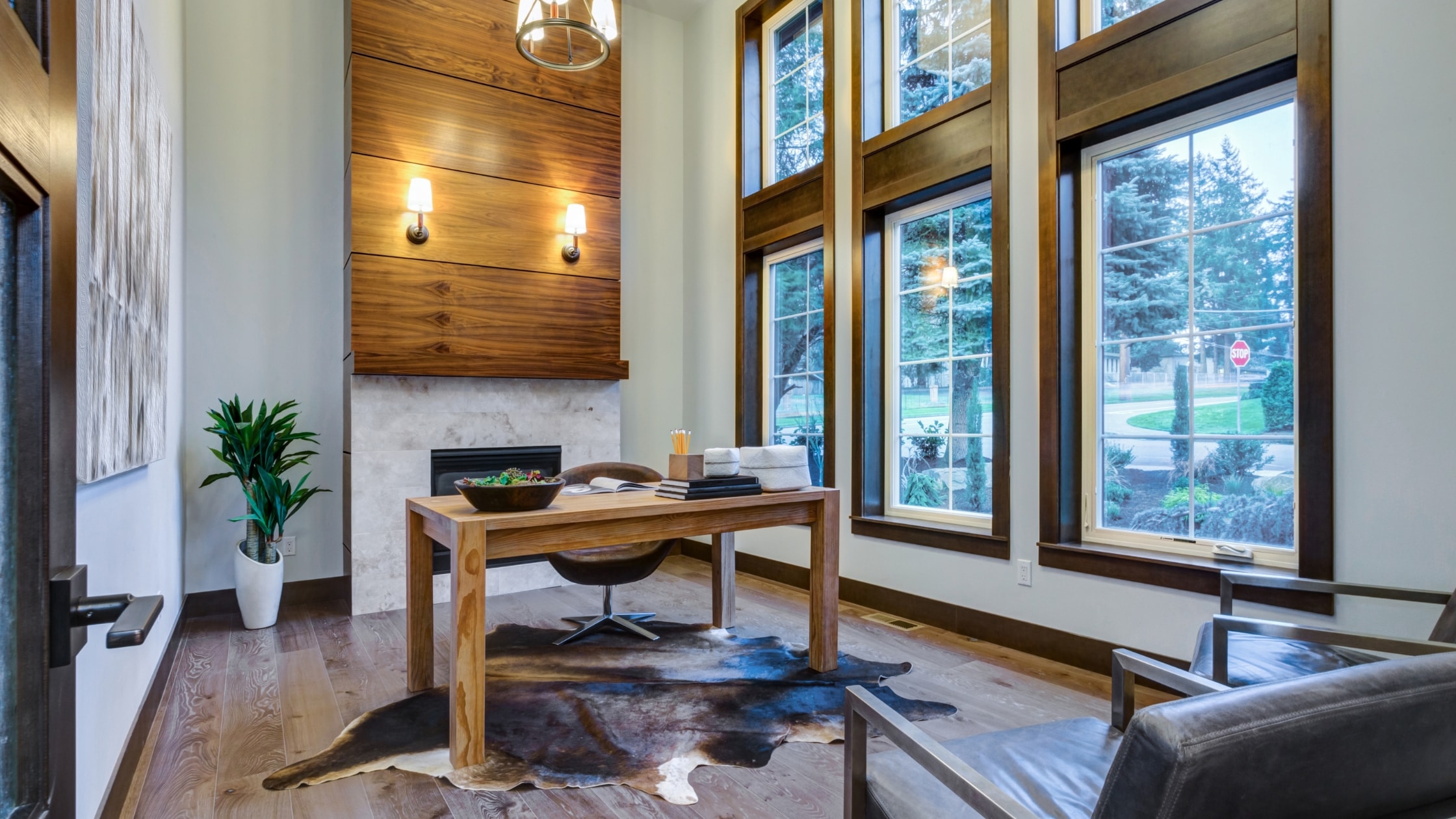 Bright modern office with large windows, wooden accents, and contemporary furniture.