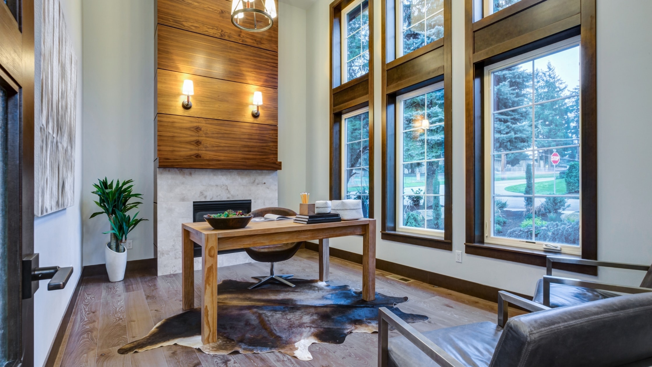 Bright modern office with large windows, wooden accents, and contemporary furniture.