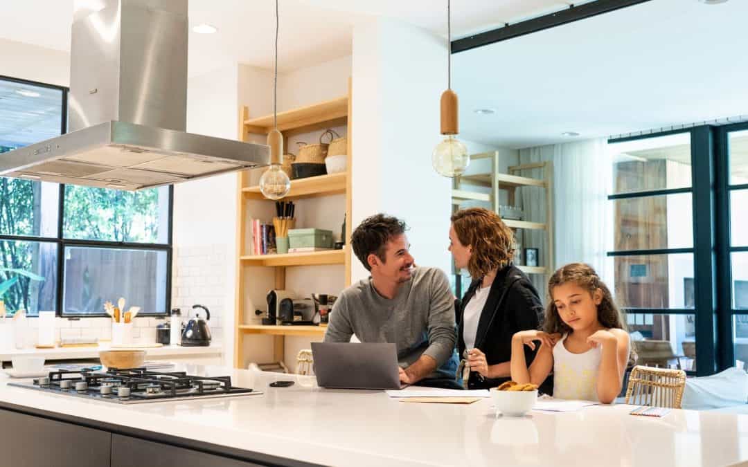 Bright modern kitchen with family enjoying time together at the counter.