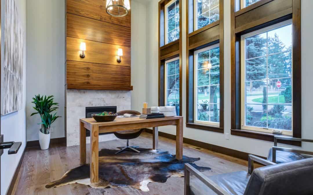 Bright modern office with large windows, wooden accents, and contemporary furniture.