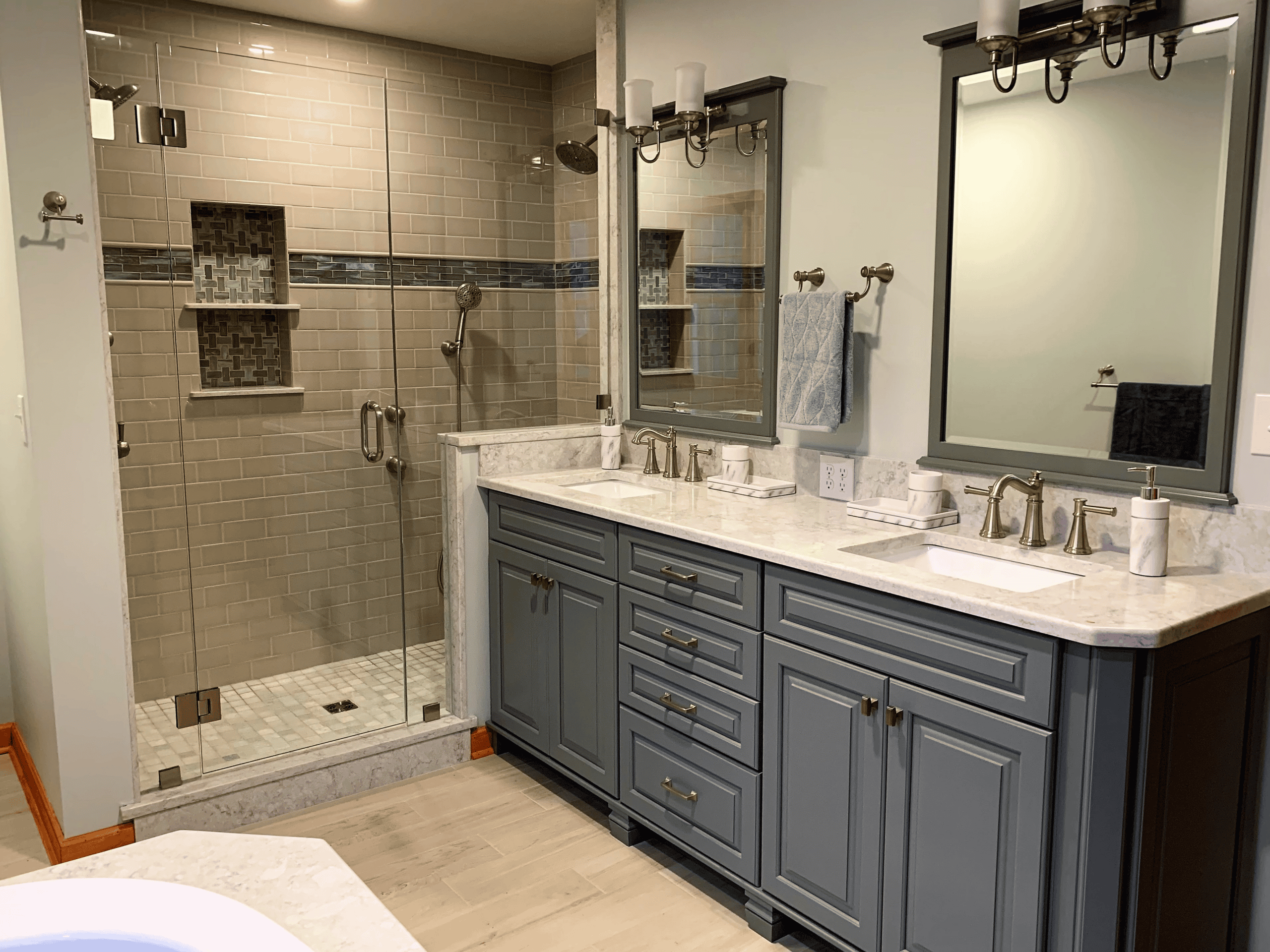 Dual vanity bathroom with walk-in shower, modern fixtures, and elegant design.