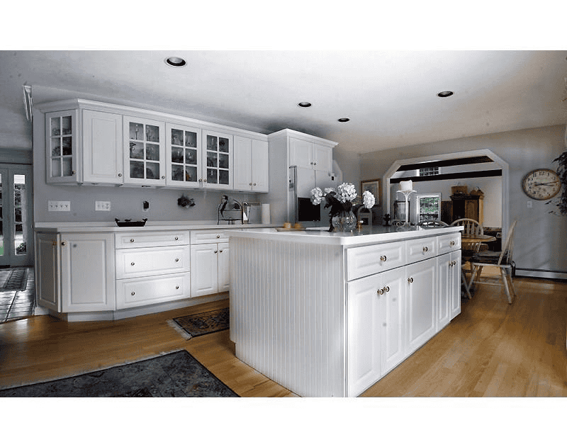 Modern white kitchen with custom cabinetry and island.