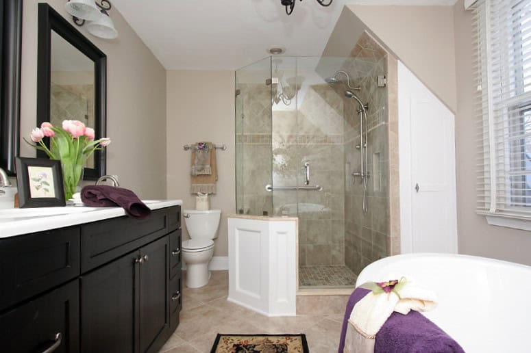 Bright and spacious bathroom with a glass shower enclosure and elegant fixtures.
