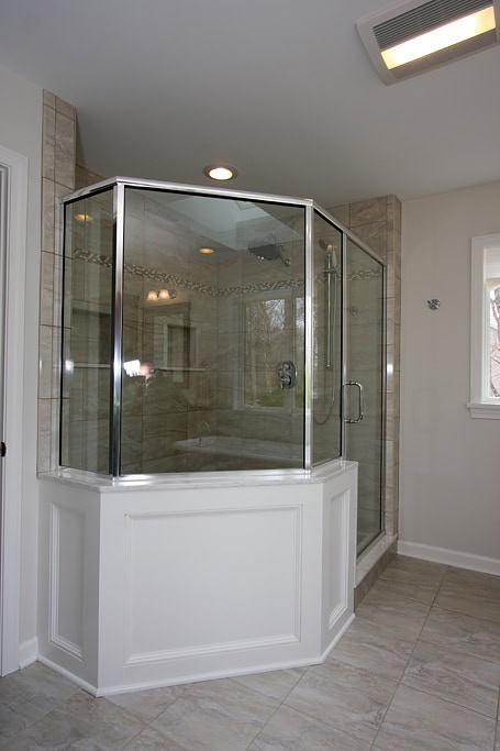 Elegant glass shower enclosure in a contemporary bathroom setting.