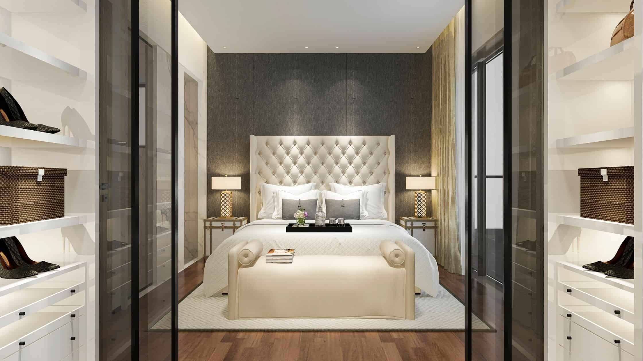 Elegant modern bedroom with plush bed, stylish decor, and ample storage space.