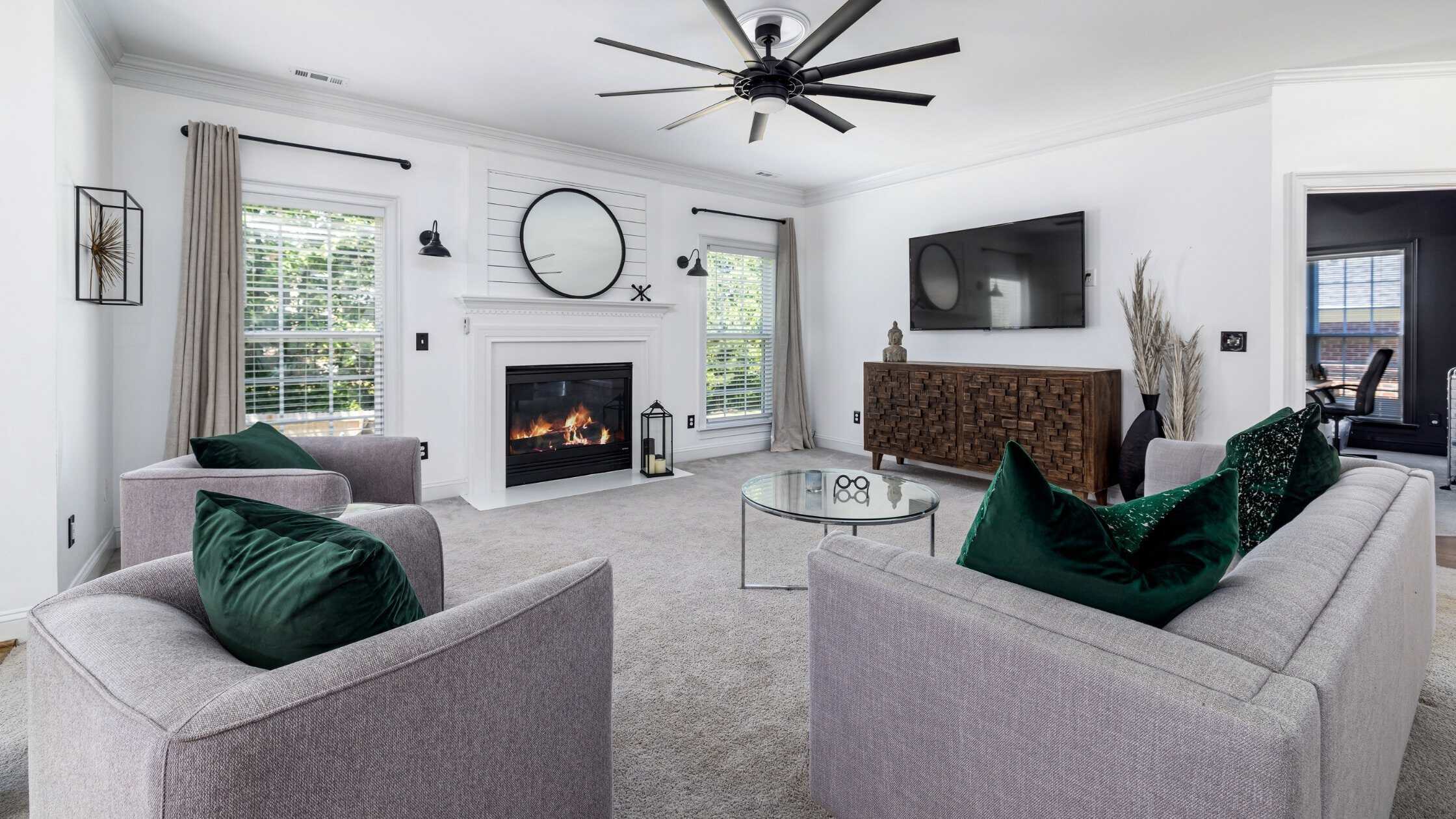 Living room with cozy fireplace and contemporary decor.