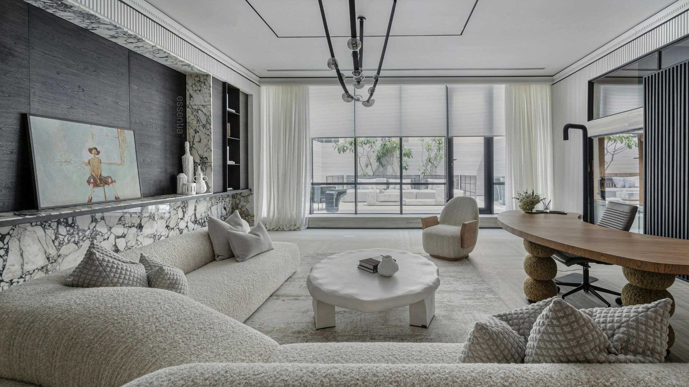 Bright and spacious living room with large windows, contemporary furniture, and elegant decor.