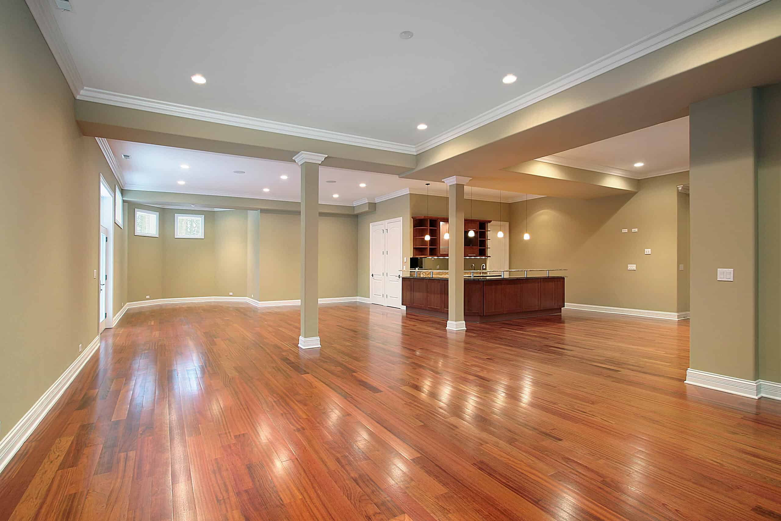Spacious modern living room with hardwood floors and open layout.